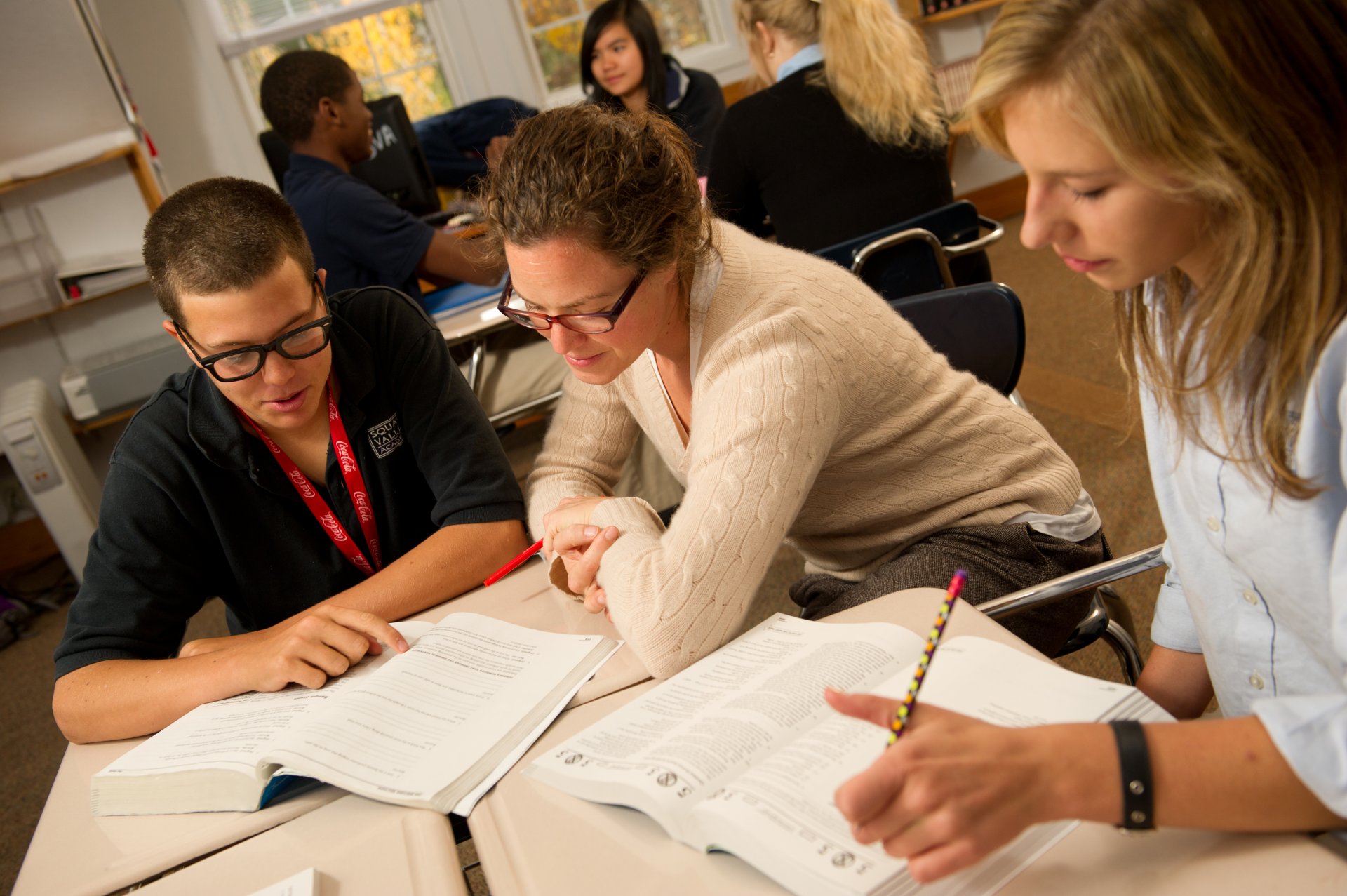 soccer coach in huddle with team