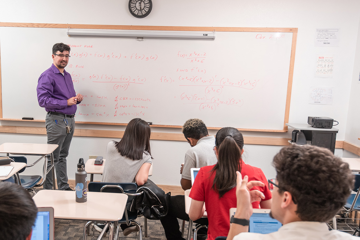 math teacher with students in classroom