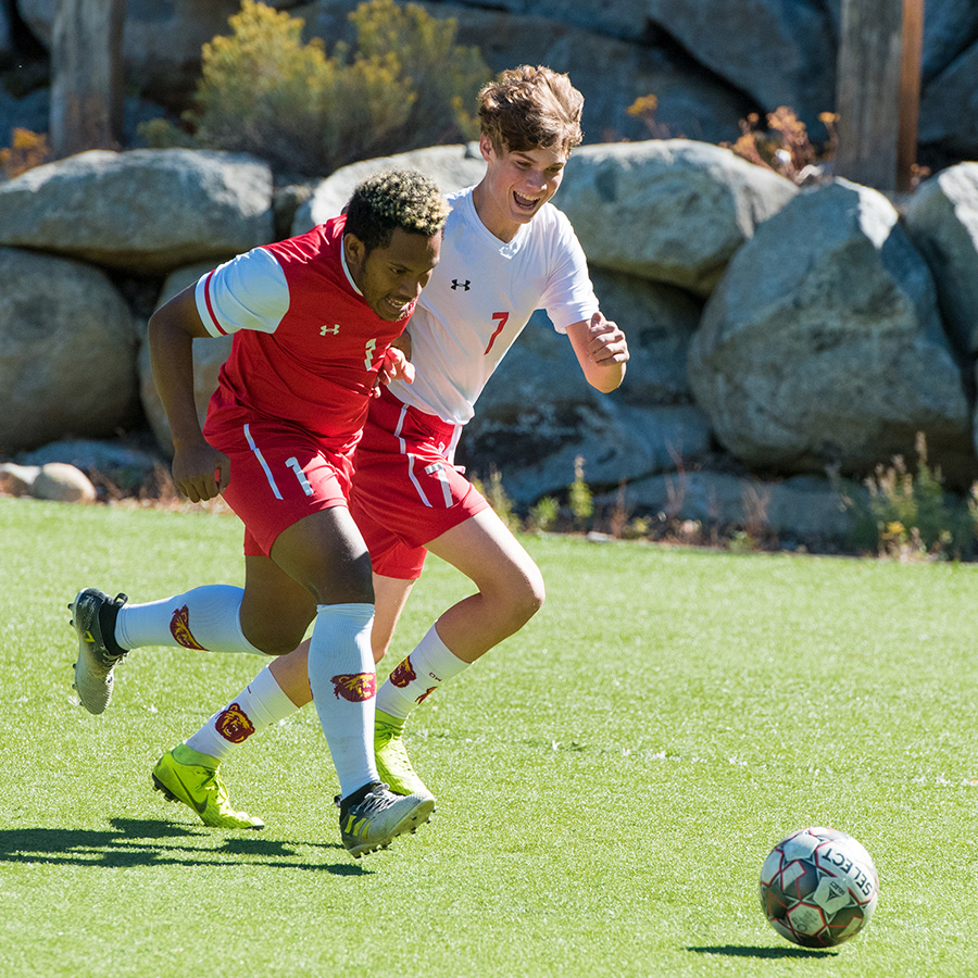 students playing soccer