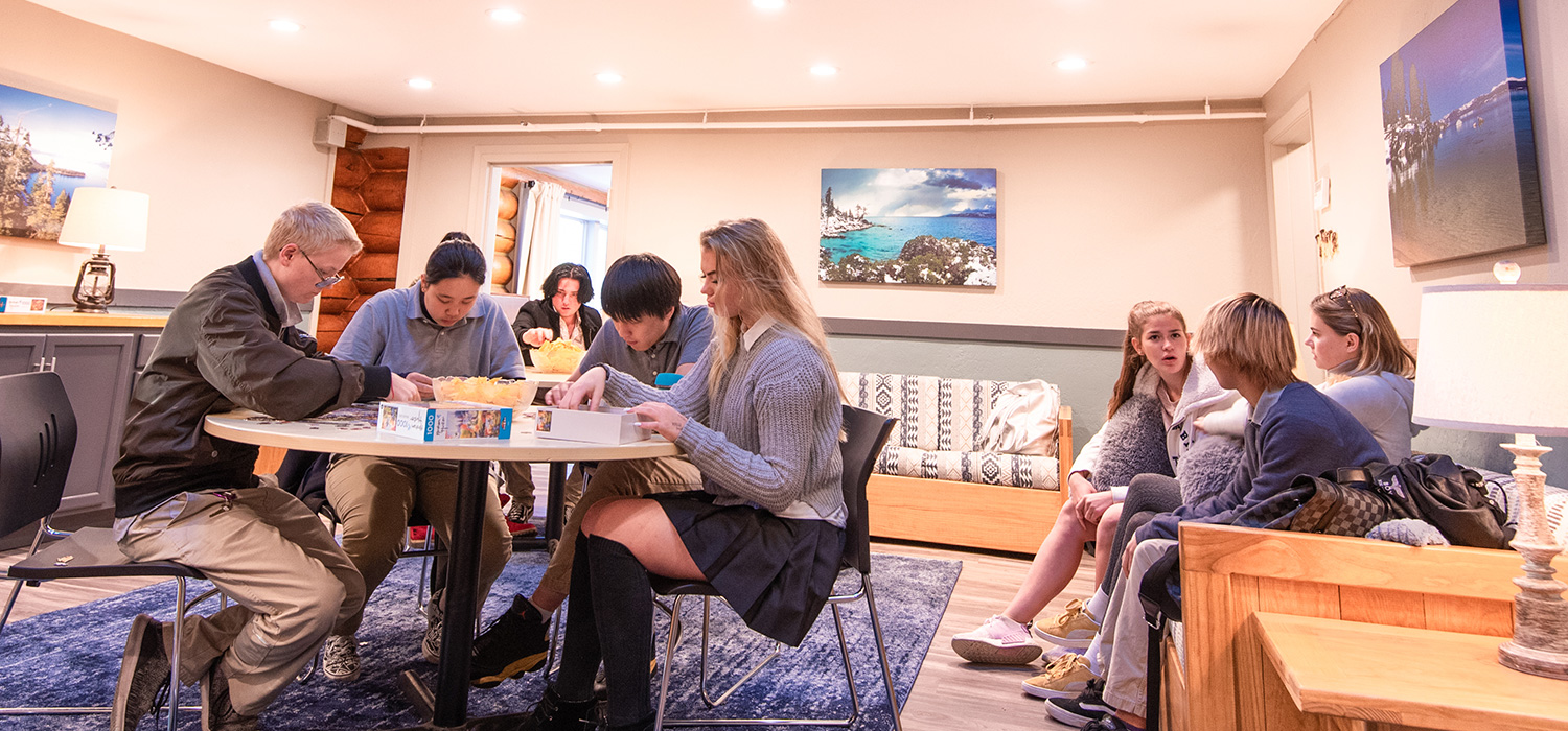 Students playing games in lounge area