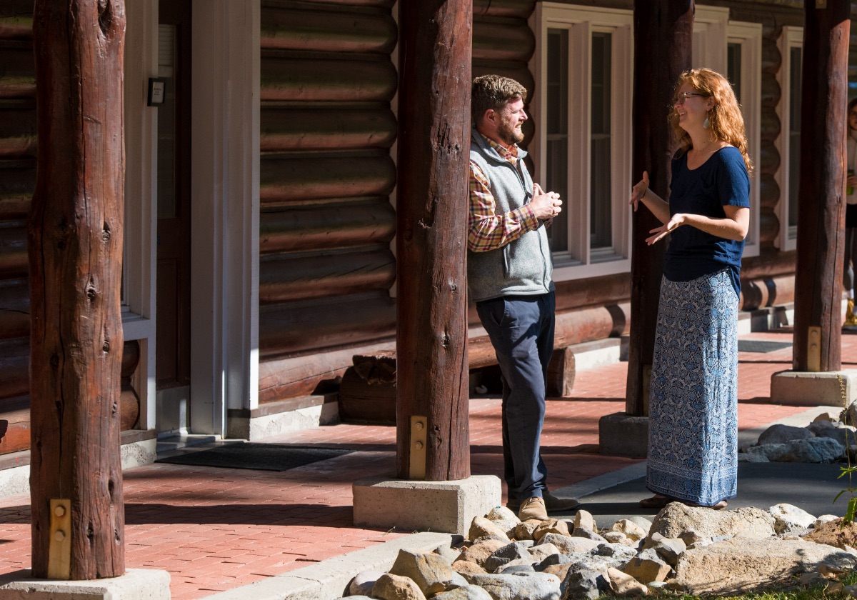 Dorm parents outside dorm building